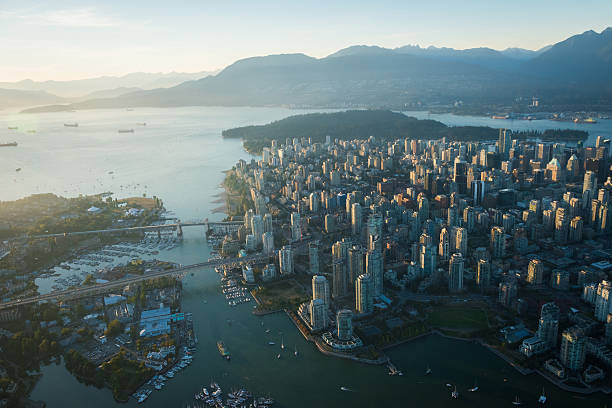 Aerial Image of Vancouver, British Columbia, Canada Aerial Image of Vancouver, British Columbia, Canada with Stanley Park, downtown, Granville Bridge, Burrard Street Bridge and waterfront vancouver stock pictures, royalty-free photos & images