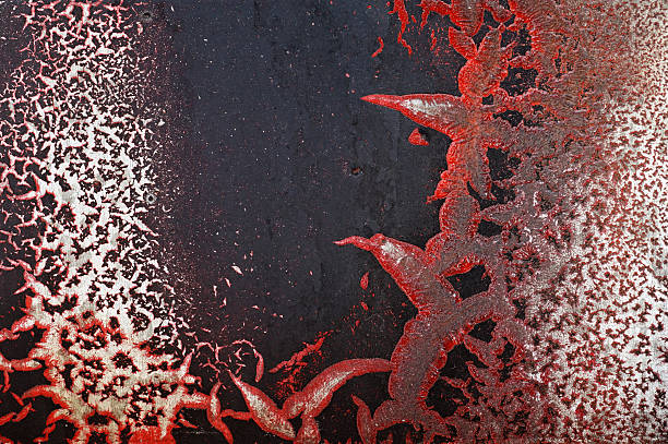 istock Cracked red paint on grunge metal surface - macro 8 628986954