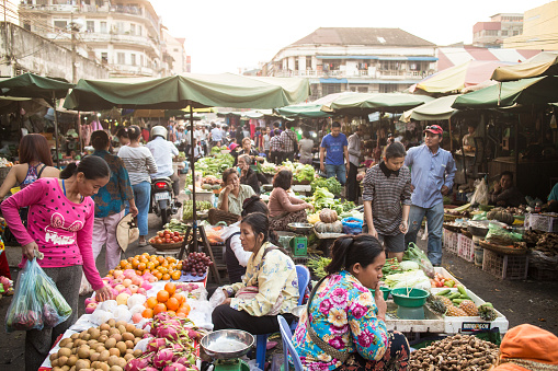 Phnom Penh, Cambodia - January 24, 2015: Local people shop in a traditional market in Phnom Penh, Cambodia capital city.