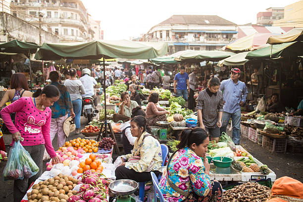 Phnom Penh market Phnom Penh, Cambodia - January 24, 2015: Local people shop in a traditional market in Phnom Penh, Cambodia capital city. cambodia food stock pictures, royalty-free photos & images