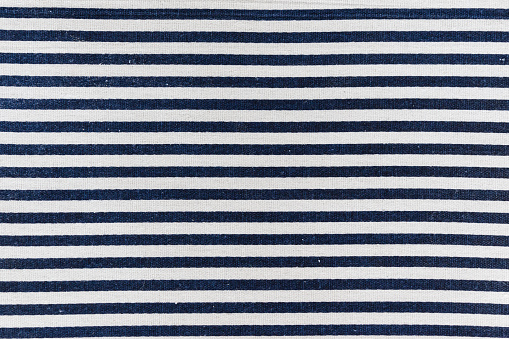 closeup of navy blue and white striped textile