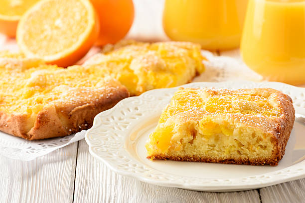 istock Orange cake and orange juice on white wooden background. 628993790