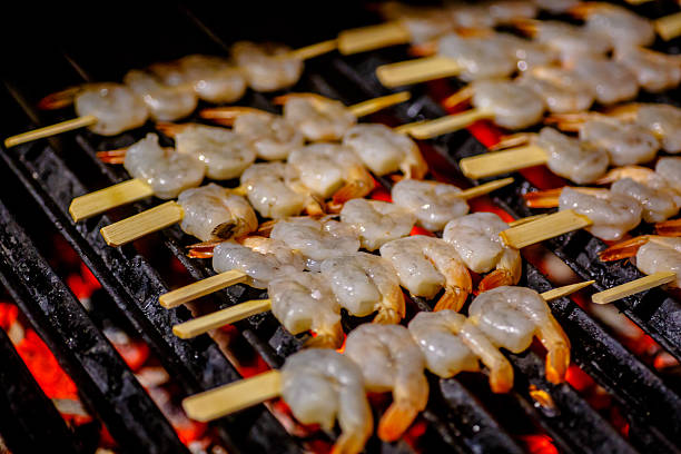istock Shrimp fried in a lattice on the grill. Barbecue. 628994960