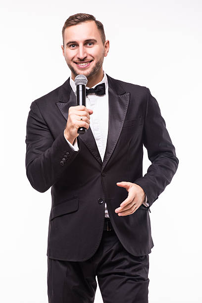 istock Young man in suit singing over the microphone with energy 628997458