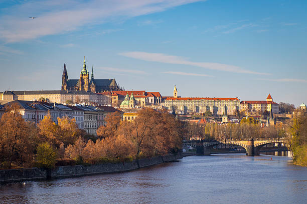 Prague castle and Vltava river View of Prague Castle with St. Vitus cathedral and Vltava (Moldau) river in autumn hradcany castle stock pictures, royalty-free photos & images