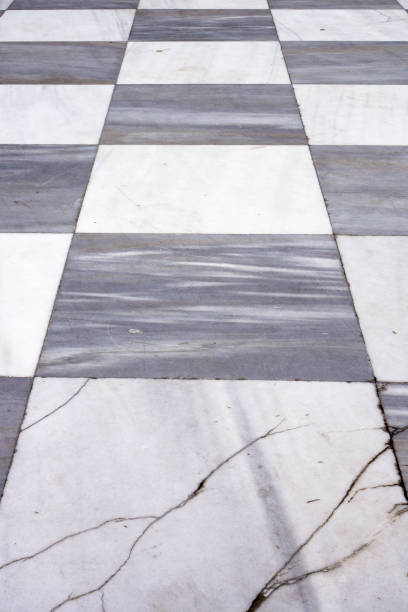 istock Black and white checkered marble floor tiles 629006018