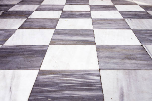 istock Black and white checkered marble floor tiles 629007456