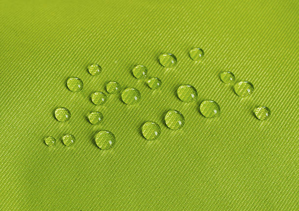 istock Green waterproof fabric with waterdrops 629007666