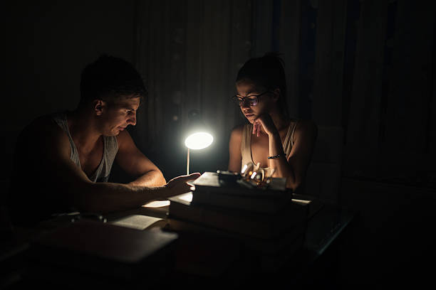 istock Couple students studying together at home 629009666