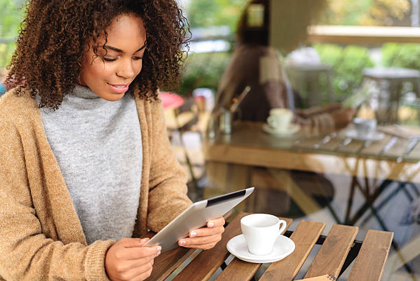 istock girl holding a smal portative computer 629010780