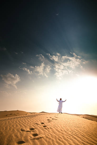 istock arabic sheik on the deser praying 629012516
