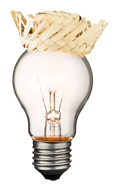 Glowing light bulb with a straw hat isolated on white background with a clipping path