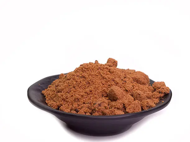 Brown sugar in bowl ,Put on a white background.