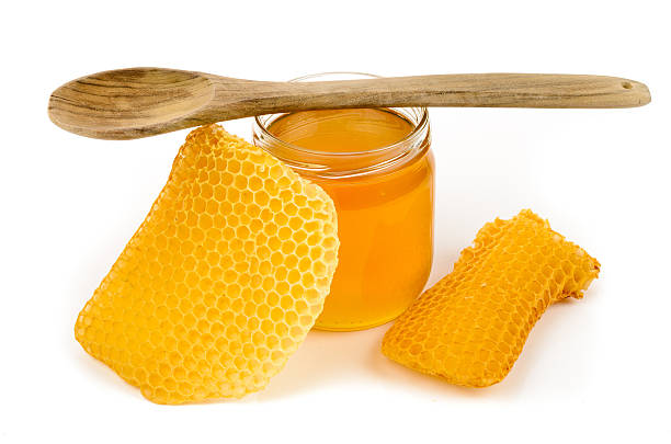 miel  - spoon honey cute jar photos et images de collection