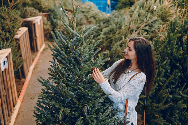 istock girl and Christmas tree 629022694