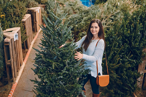 istock girl and Christmas tree 629022886