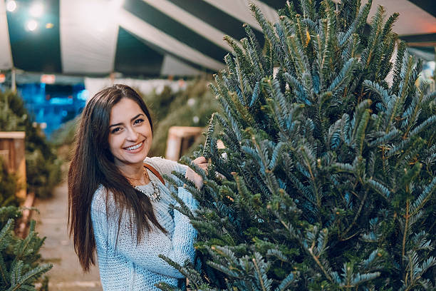 istock girl and Christmas tree 629023158