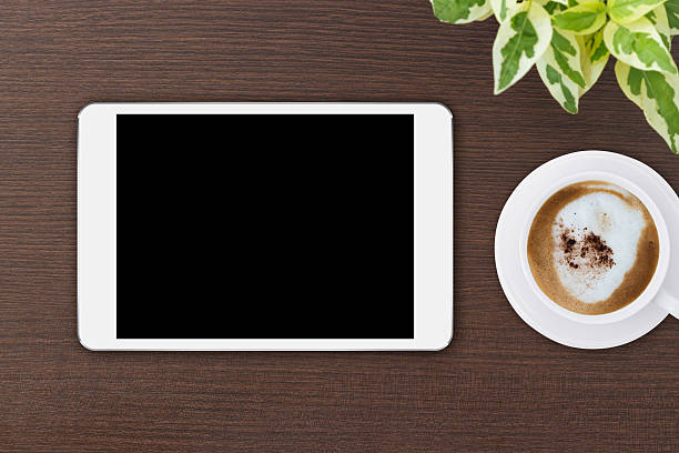 istock mock-up tablet blank screen on wood top view 629024282
