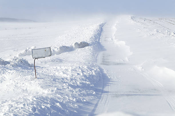 istock Drifting Snow on a Rural Road 629024668