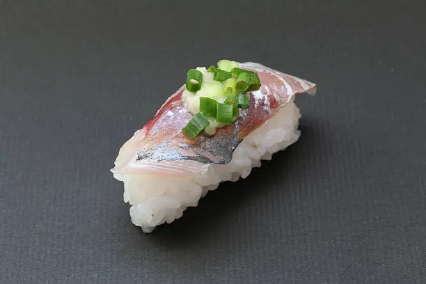 Japanese fresh horse mackerel sushi on black background
