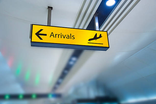 Arrivals board Arrivals board in airport arrival stock pictures, royalty-free photos & images
