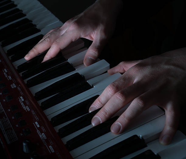 istock Hands musician playing the piano closeup 629027854