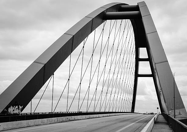 istock Low Angle View Of Bridge Against Cloudy Sky 629032411