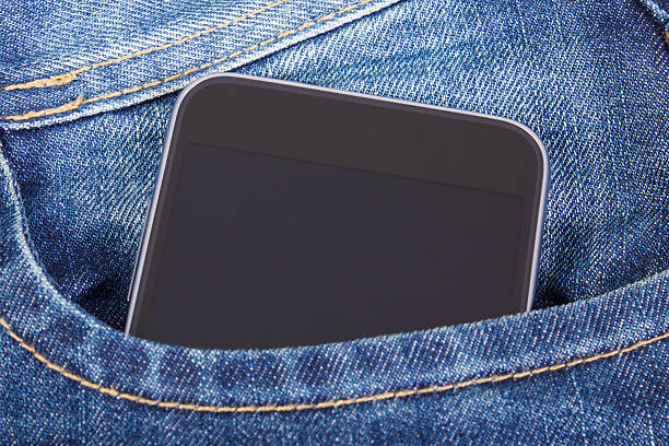 istock Mobile phone with blank screen in pocket jeans, smartphone 629033584
