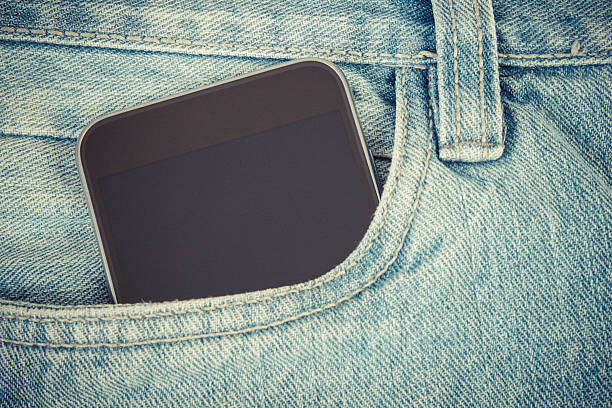 istock Mobile phone with blank screen in pocket jeans, smartphone 629034440