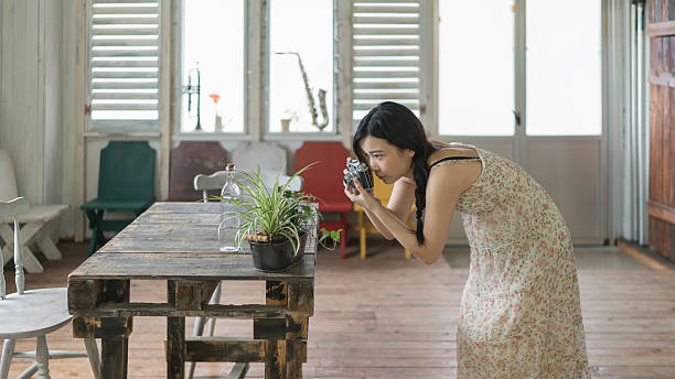 istock Young girl taking photo in a room 629036362