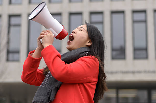 modern young chinese woman protesting - xian audio imagens e fotografias de stock