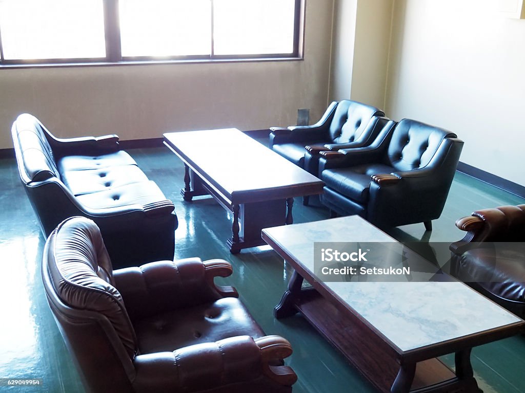 Empty Reception Room Empty reception room with comfy sofas and tables. Old-fashioned Stock Photo