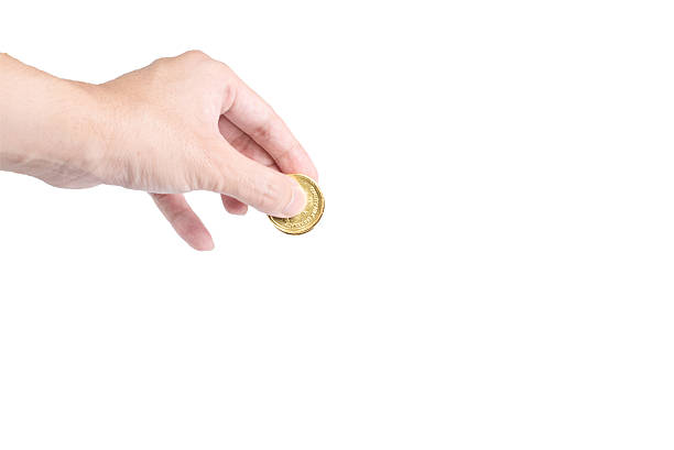 istock The chocolate gold coin  in hand on white background 629052232