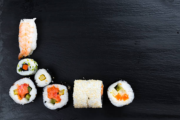 istock Japanese sushi on black kitchen slate plate. 629053854