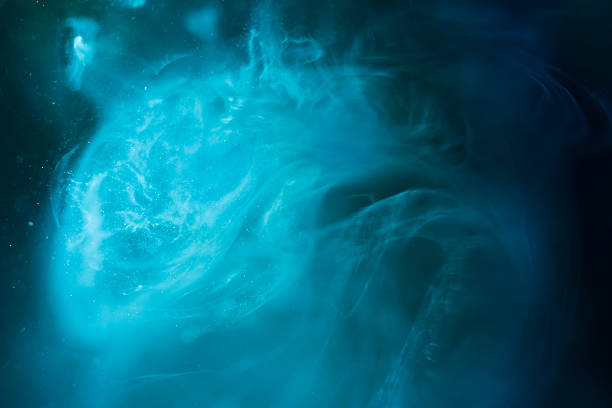 istock Oil, water and ink mixing for a beautiful space galaxy 629061458
