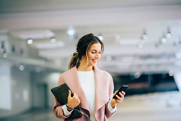 istock Happy beautiful woman texting 629062468