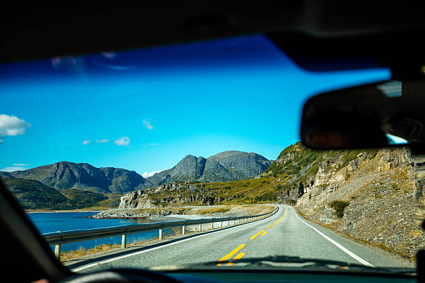 istock Driving a car on mountain road 629062500