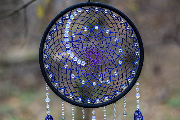 istock Dreamcatcher made of feathers, leather, beads, and ropes 629063892