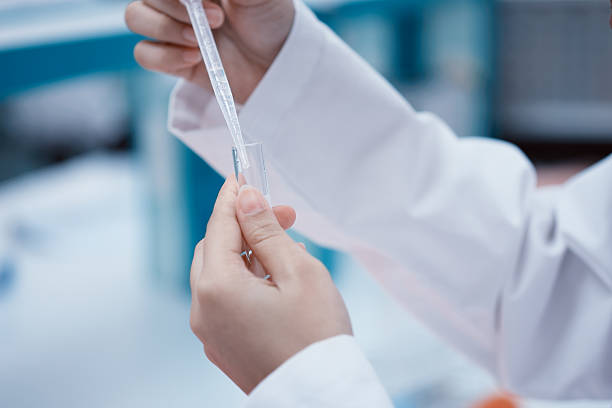 istock Hand of scientist and pipette 629073064