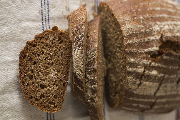 istock Sliced rye bread background linen cloth 629073726