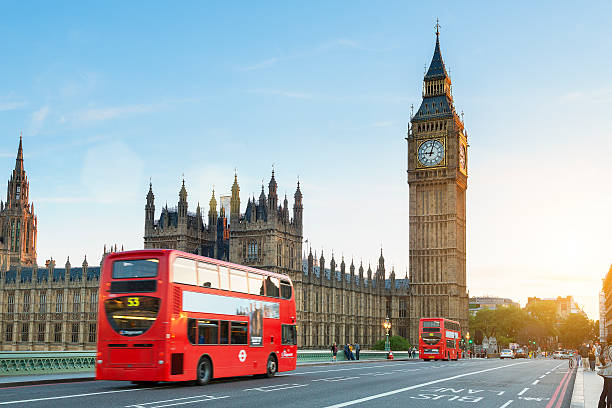 London, Traffic on the Westminster bridge London, United Kingdom - August 20, 2016: Westminster palace and Big Ben and traffic on Westminster bridge in foreground clock tower stock pictures, royalty-free photos & images