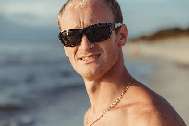 lifeguard on the beach with glasses - men refreshment male summer imagens e fotografias de stock