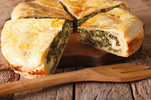 istock Tasty sliced Greek pie with spinach and cheese close-up. horizontal 629076656