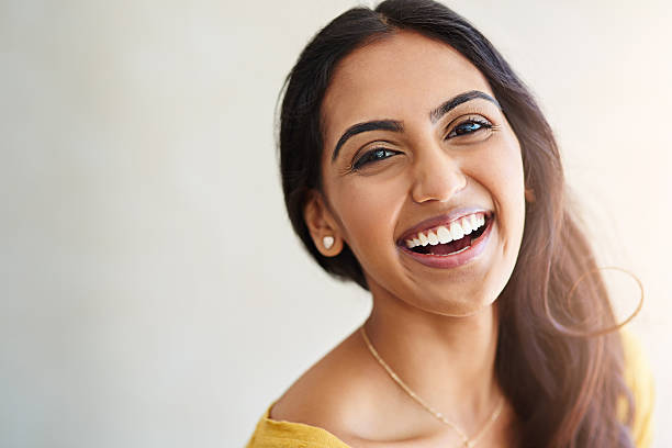 Living my own happily ever after Studio portrait of an attractive and happy young woman indian woman laughing stock pictures, royalty-free photos & images