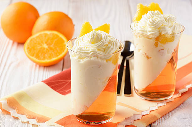 istock Orange jelly with whipped cream and orange fruit. 629077970