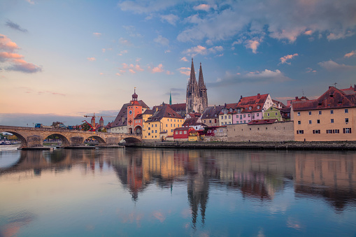 Cityscape image of Regensburg, Germany during sunset.