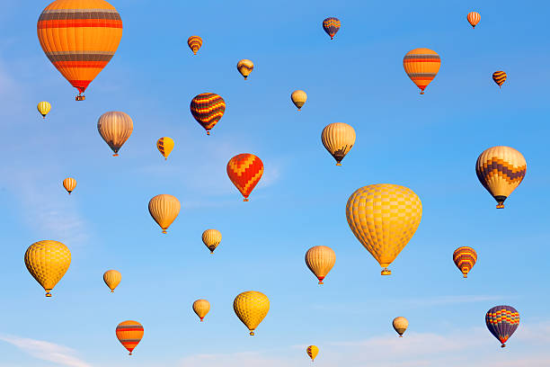 istock Vibrant colorful air balloons in blue sky. 629079458