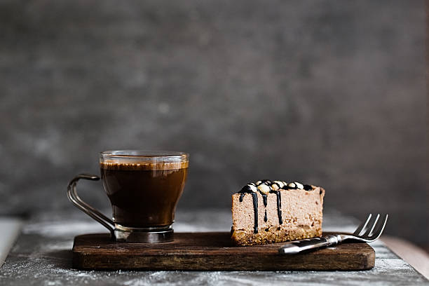 Vegan chocolate mousse cake and coffee on a stone background stock photo