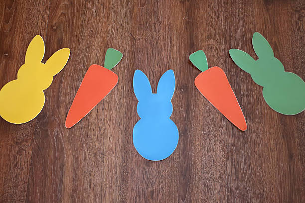 istock Easter bunnies and carrots garland 629079890
