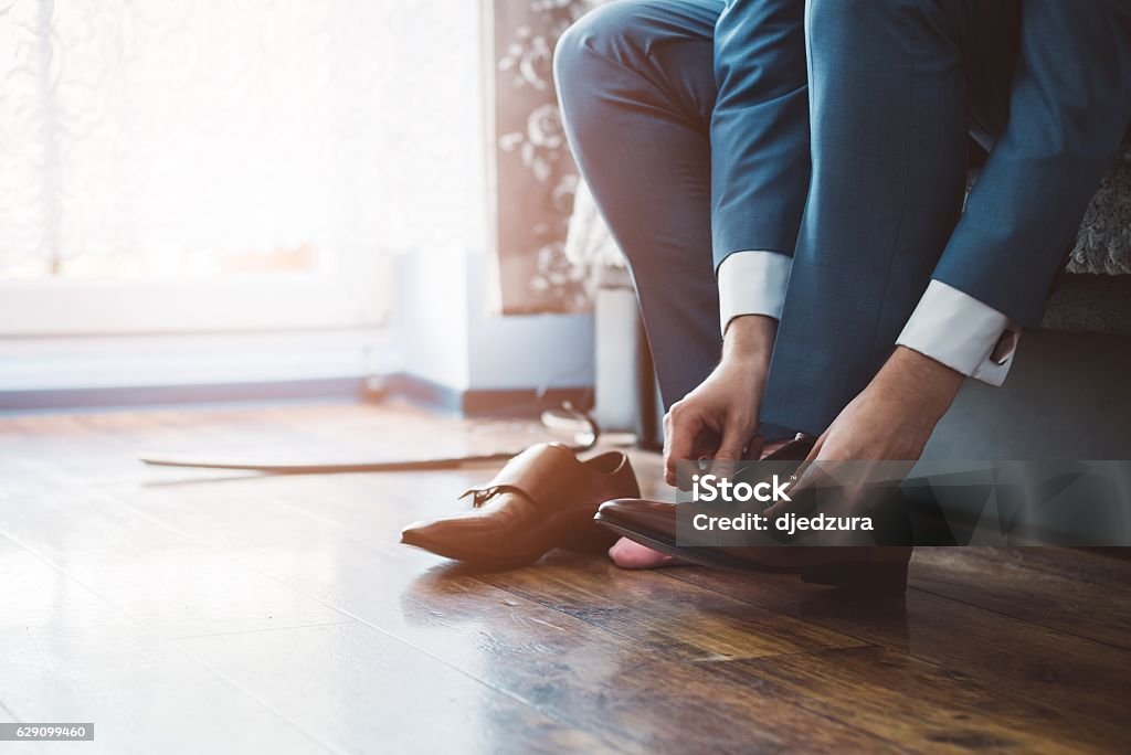 Groom dressing up with classic elegant shoes. Business man or groom dressing up with classic elegant shoes. Shoe Stock Photo